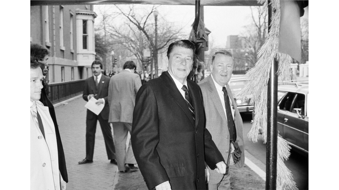 FILE - President-elect Ronald Reagan and his transition team leader Edwin Meese leave the Blair House in Washington, Dec. 10, 1980.