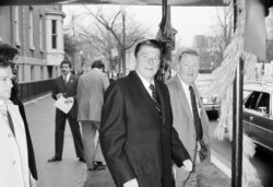 FILE - President-elect Ronald Reagan and his transition team leader Edwin Meese leave the Blair House in Washington, Dec. 10, 1980.