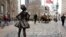 A statue titled "Fearless Girl" faces the Wall Street bull in New York, March 8, 2017. 