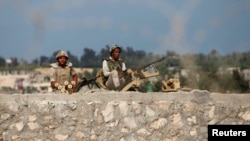 Egyptian soldiers keep guard on the border between Egypt and southern Gaza Strip, July 8, 2013.