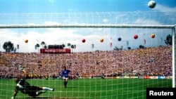 FILE - Italy's Roberto Baggio puts his penalty over the bar in the World Cup final against Brazil at the Rose Bowl in Pasadena, California, July 17, 1994. 