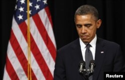FILE - U.S. President Barack Obama speaks at a vigil held at Newtown High School for families of victims of the Sandy Hook Elementary School shooting in Newtown, Connecticut, Dec. 16, 2012.