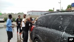 Somali-Americans in Minnesota at a car washing fundraiser to help Somali drought victims.