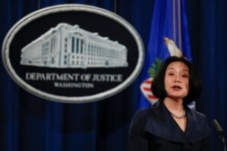 FILE - Jessie Liu, U.S. Attorney for the District of Columbia, speaks during a news conference at the Justice Department in Washington, Dec. 15, 2017.