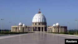 FILE: "Our Lady of Peace" basilica, one of the world largest churches, was built in Yamoussoukro, Ivory Coast, from 1986 to 1989 at an estimated cost of $400 million. The edifice is modeled on Saint Peter's Basilica in Rome. Taken April 15, 2005.
