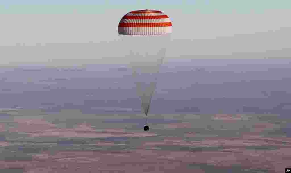 A Russian Soyuz MS-08 space capsule lands about 150 kilometers southeast of the Kazakh town of Dzhezkazgan, Kazakhstan.