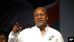 FILE - Ghana Incumbent President, John Dramani Mahama candidate of the National Democratic Congress gesture to his supporters during a presidential election rally at Accra Sports Stadium in Accra, Ghana, Dec. 5, 2016. 