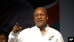 Ghana Incumbent President, John Dramani Mahama candidate of the National Democratic Congress gesture to his supporters during a presidential election rally at Accra Sports Stadium in Accra, Ghana, Monday, Dec. 5, 2016. The Ghana election will take place on Dec. 7.