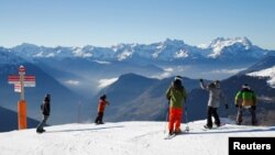 Skiers ride on the slopes at the season's start in the Verbier ski resort in Verbier, Switzerland, November 28, 2016.