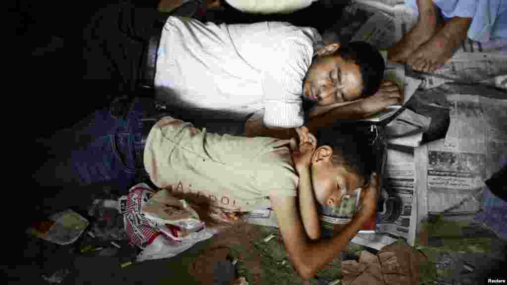 Protesters sleep during a sit-in at Tahrir Square on Friday.