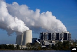 FILE - The Jaenschwalde coal-fired power plant operates in Jaenschwalde, Germany, Oct. 16, 2024.