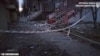 Debris is scattered along a street after shelling in a residential block in Kherson, Ukraine, in this screengrab taken from a video released on Dec. 3, 2023. Kherson Regional State Administration/Handout via REUTERS. 
