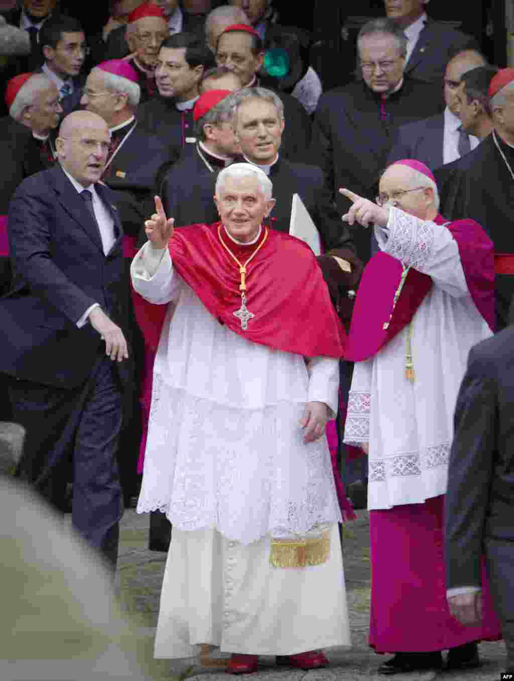 Pope Benedict XVI, center, talks to Julian Barrio, Archbishop of Santiago de Compostela, right, as the Pope arrives to the Cathedral in Santiago de Compostela, northern Spain, on Saturday, Nov. 6, 2010. The Pope visits the pilgrimage city of Santiago de C