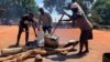 Volunteers prepare a meal March 26, 2019, for children at Ngangu Primary School in Chimanimani, which is being used to help children cope with Cyclone Idai trauma they may have experienced.