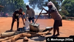 Volunteers prepare a meal March 26, 2019, for children at Ngangu Primary School in Chimanimani, which is being used to help children cope with Cyclone Idai trauma they may have experienced.