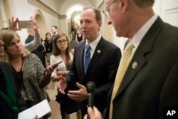 FILE - The leaders of the House Intelligence Committee, Rep. Adam Schiff, D-Calif. (C), and Rep. Mike Conaway, R-Texas (R) speak with reporters after a closed-door meeting at the Capitol with Sheryl Sandberg, chief operating officer of social media giant Facebook.