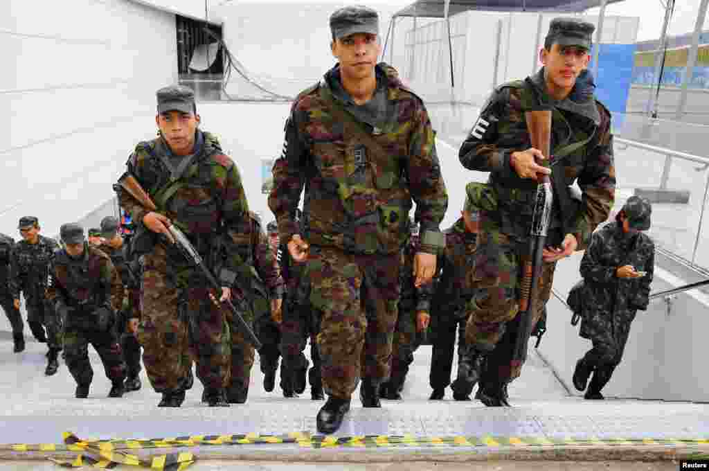 Armed Brazilian soldiers are deployed to provide security at the Corinthians arena, Sao Paulo, June 11, 2014.