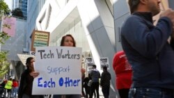 In this photo taken July 16, 2019, tech workers march to support Facebook's cafeteria workers, who were rallying for a new contract with their company Flaghship in San Francisco.