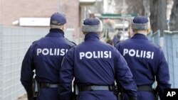 FILE - Finnish police officers are seen on patrol in Tampere, Finland.