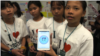 Lorn Dara Soucheng, 12, (middle), team leader and other team members show the Cambodia Identity Product app that they have created at the Technovation Challenge World Pitch Summit girl mobile app competition at Google headquarters in Mountain View, CA, Wednesday, August 09, 2017. (Sophat Soeung/VOA Khmer) 