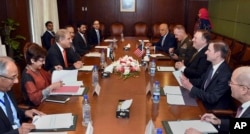 In this photo released by Press Information Department, visiting U.S. Secretary of State Mike Pompeo, third right, talks with Pakistan's foreign minister Shah Mahmood Qureshi, third left, in Islamabad, Sept. 5, 2018.