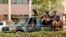 FILE - Troops ride in a vehicle near the French Embassy in central Ouagadougou, Burkina Faso, March 2, 2018.