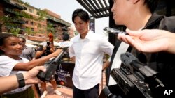 Shohei Ohtani, of the Los Angeles Angels, arrives to a news conference to be named the American League's starting pitcher for the MLB All-Star baseball game, Monday, July 12, 2021, in Denver. (AP Photo/David Zalubowski)