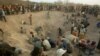 (FILE) -- This Nov. 1, 2006 file photo shows miners digging for diamonds in Marange, eastern Zimbabwe. 