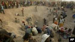 FILE - Miners dig for diamonds in Marange, eastern Zimbabwe, Nov. 1, 2006.