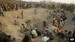 FILE - Miners digging for diamonds in Marange, eastern Zimbabwe, Nov. 1, 2006.