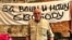 Pavel Litvinov at a Moscow exhibit to mark the 50th anniversary of his demonstration against the Soviet Union's invasion of Czechoslovakia in 1968. Behind him is a reproduction of the banner he and 7 other protesters unfurled on Red Square. It reads: "For Your Freedom and Ours." 
