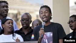 Members of Uganda's gay community lead a choir during a memorial service for David Kato, one of the country's most visible gay campaigners, on his first death anniversary in Kampala, January 26, 2012. 