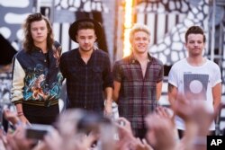 FILE - One Direction members, from left, Harry Styles, Liam Payne, Niall Horan and Louis Tomlinson perform on ABC's "Good Morning America".