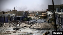 Destroyed buildings from clashes are seen, during the war between Iraqi army and Shi'ite Popular Mobilization Forces (PMF) against the Islamic State militants in Tal Afar, Iraq, Aug. 27, 2017. 