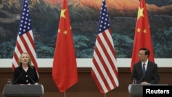 Chinese Foreign Minister Yang Jiechi (R) and U.S. Secretary of State Hillary Clinton hold a news conference at the Great Hall of the People in Beijing, September 5, 2012.