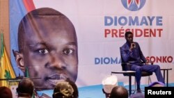 FILE—Senegalese opposition leader Ousmane Sonko and presidential candidate Bassirou Diomaye Faye hold a press conference in Dakar, Senegal March 15, 2024.