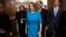 House Democratic Leader Nancy Pelosi of California, joined at by Rep. Joyce Beatty, D-Ohio, and Rep. Eric Swalwell, D-Calif., emerges victorious from the Democratic Caucus leadership elections at the Capitol in Washington, Nov. 28, 2018.