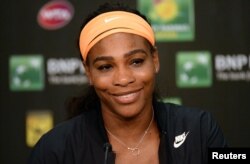 Tennis star Serena Williams talks to the media after she withdrew from the BNP Paribas Open due to a knee injury, March 20, 2015.