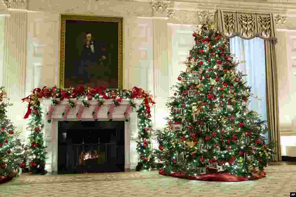 The East Room of the White House is decorated for the holiday season during a press event for the White House holiday decorations, Monday, Nov. 29, 2021, in Washington. (AP Photo/Evan Vucci)