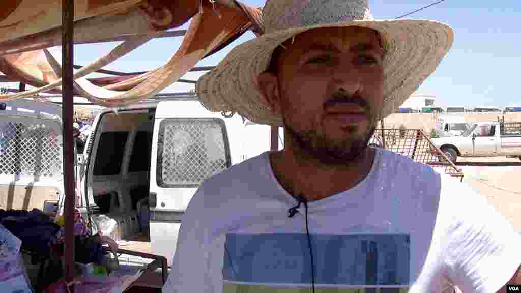 High prices for goods after Libya closed its border and Tunisia's economic downturn means hard times for Ben Guerdane market seller Choukri Yahia. (L. Bryant/VOA)