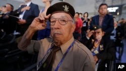 Belgium veteran of the Korean War Franciscus Ceuppens salutes during the commemorating ceremony for the U.N. Forces Participating Day in the Korean War in Seoul, South Korea, Friday, July 27, 2018.