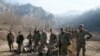 Ethnic Armenian soldiers are seen in the village of Knaravan located in a territory which is soon to be turned over to Azerbaijan under a peace deal that followed the fighting over the Nagorno-Karabakh region, Nov. 15, 2020. 