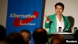 FILE - Frauke Petry, chairwoman of the anti-immigration party Alternative for Germany, attends a meeting in Berlin, Germany, Sept. 16, 2016. Petry, riding a wave of anti-immigrant sentiment in Germany, is seen as a serious challenger for Merkel in 2017.