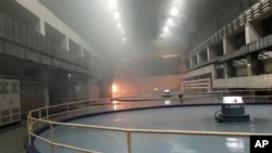 This frame grab from video provided by KK Productions shows a fire at a government-run underground electricity plant in Srisailam, in the southern Indian state of Telangana, Aug. 21, 2020. 