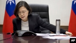 Taiwan's President Tsai Ing-wen speaks with U.S. President-elect Donald Trump through a speaker phone in Taipei, Taiwan. (Taiwan Presidential Office via AP)