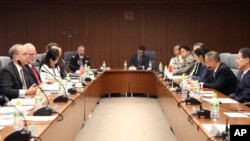 Assistant Secretary of State for East Asian and Pacific Affairs Daniel Russel, left, speaks as Assistant Secretary of Defense for Asian and Pacific Security Affairs David Shear, second from left, Director General of North American Affairs Bureau, Koji Tom