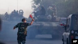 FILE - Azerbaijan's army tanks moves in the direction of Agdam, Azerbaijan. 