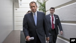 House Speaker John Boehner of Ohio walks to a closed-door Republican strategy session, Wednesday, Dec. 5, 2012, on Capitol Hill in Washington.
