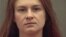 FILE - Maria Butina appears in a police booking photograph released by the Alexandria Sheriff's Office in Alexandria, Virginia, Aug. 18, 2018.