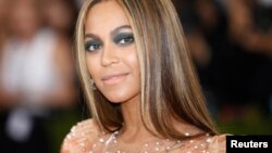 FILE - Singer-Songwriter Beyonce Knowles arrives at the Metropolitan Museum of Art Costume Institute Gala (Met Gala) to celebrate the opening of "Manus x Machina: Fashion in an Age of Technology" in the Manhattan borough of New York.